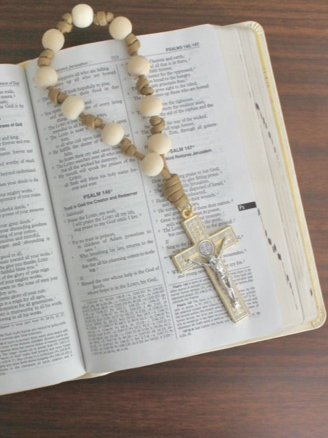 Handmade one decade door rosary by Knots of Grace, Light of Faith St. Benedict Door Rosary, tan (pictured on bible)