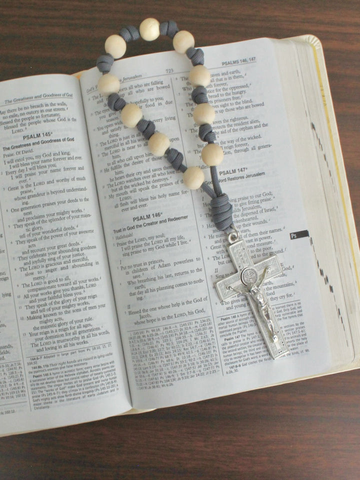 Handmade one decade door rosary by Knots of Grace, Divine Peace St. Benedict Door Rosary, gray (pictured on bible)