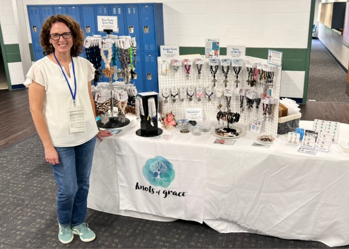 Kathleen, founder and maker of Knots of Grace, at a local pop-up event.